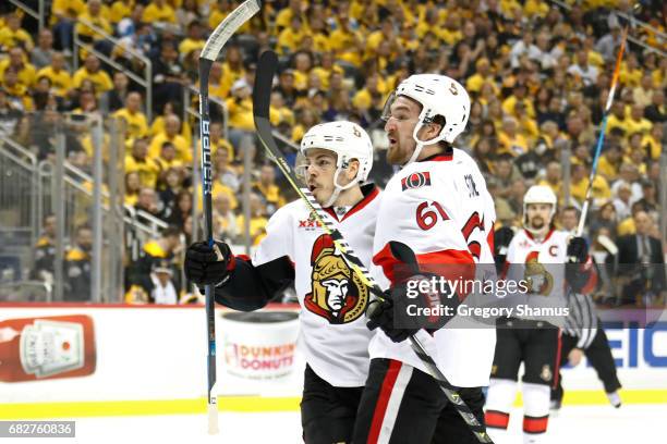 Jean-Gabriel Pageau of the Ottawa Senators celebrates with his teammate Mark Stone after scoring a goal against Marc-Andre Fleury of the Pittsburgh...