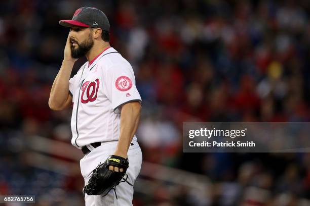 Starting pitcher Tanner Roark of the Washington Nationals reacts after giving up an RBI single to Michael Saunders of the Philadelphia Phillies...