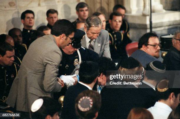 Woman identified as Eva Mozes Kor, of Terre Haute, Ind., is hustled from the scene by security personnel inside the Capitol Rotunda 5/6 during a...