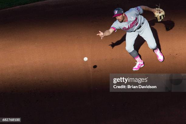 Hardy of the Baltimore Orioles assists in a double play against the Kansas City Royals during the first inning at Kauffman Stadium on May 13, 2017 in...