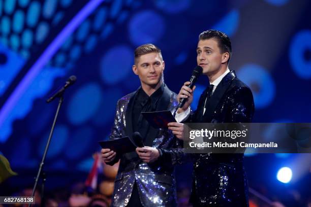 Presenters Oleksandr Skichko and Volodymyr Ostapchuk speak on stage during the final of the 62nd Eurovision Song Contest at International Exhibition...