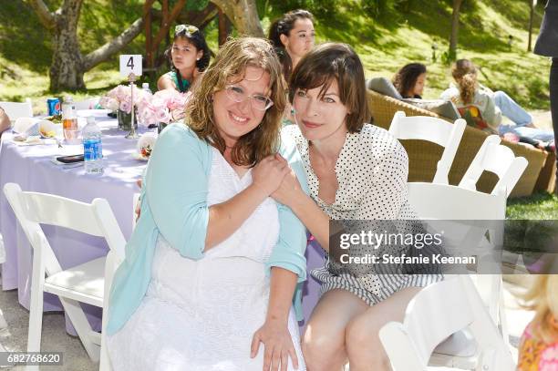 Milla Jovovich and guest attend Cindy Crawford and Kaia Gerber host Best Buddies Mother's Day Brunch in Malibu, CA sponsored by David Yurman on May...