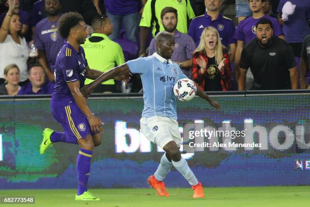 Ike Opara of Sporting Kansas City defends against Giles Barnes of Orlando City SC during an MLS soccer match between Sporting Kansas City and the...