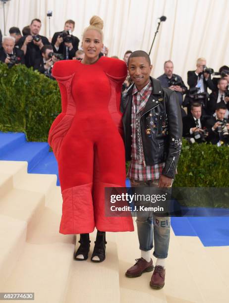 Helen Lasichanh and Pharrell Williams attend the "Rei Kawakubo/Comme des Garcons: Art Of The In-Between" Costume Institute Gala at Metropolitan...