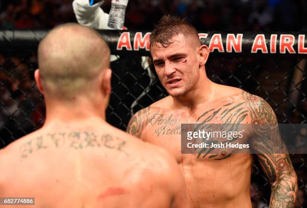 Dustin Poirier talks to Eddie Alvarez in their lightweight fight during the UFC 211 event at the American Airlines Center on May 13, 2017 in Dallas,...