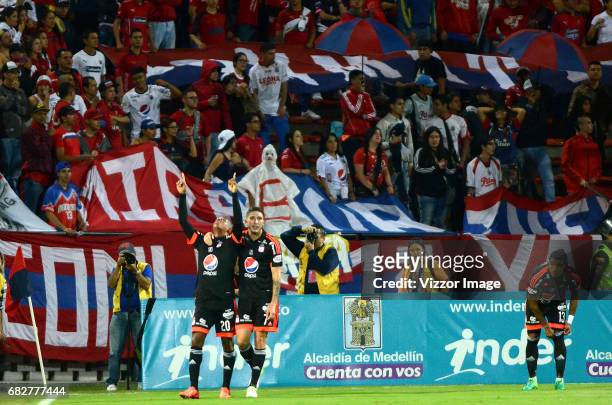 Steven Lucumi of America de Cali celebrates with teammate Luis Carlos Arias after scoring the first goal of his team during a match between...