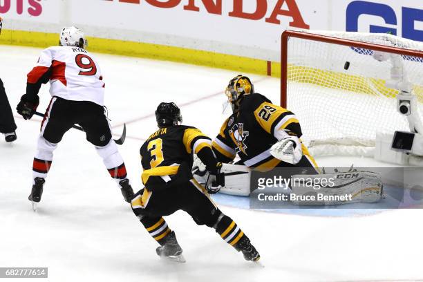 Bobby Ryan of the Ottawa Senators scores a goal against Marc-Andre Fleury of the Pittsburgh Penguins in overtime of Game One of the Eastern...