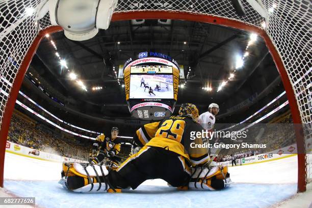 Bobby Ryan of the Ottawa Senators scores a goal against Marc-Andre Fleury of the Pittsburgh Penguins in overtime of Game One of the Eastern...