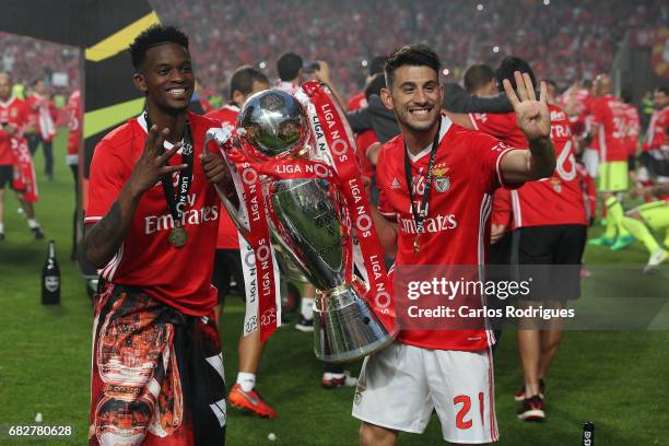 Benfica's defender Nelson Semedo from Portugal and Benfica's forward Pizzi from Portugal celebrating the tetra title with his team mates after the...