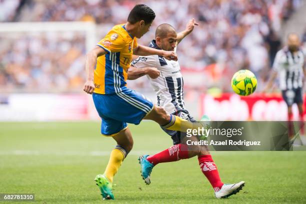 Hugo Ayala of Tigres fights for the ball with Walter Gargano of Monterrey during the quarter finals second leg match between Monterrey and Tigres...