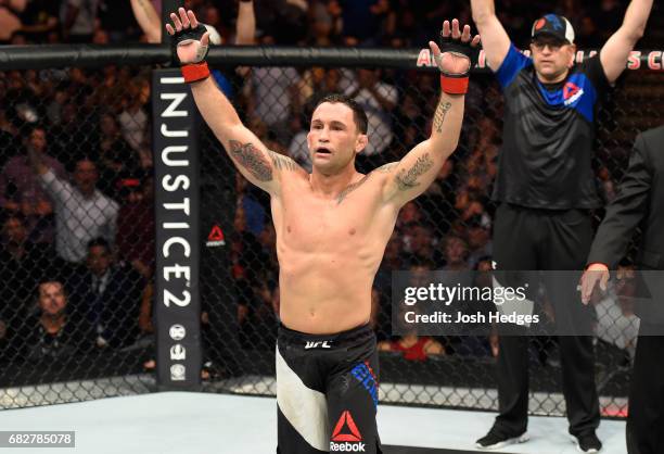 Frankie Edgar celebrates his victory over Yair Rodriguez in their featherweight fight during the UFC 211 event at the American Airlines Center on May...