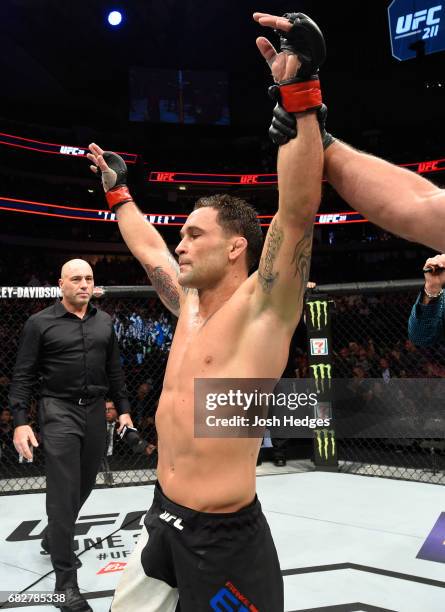 Frankie Edgar celebrates his victory over Yair Rodriguez in their featherweight fight during the UFC 211 event at the American Airlines Center on May...