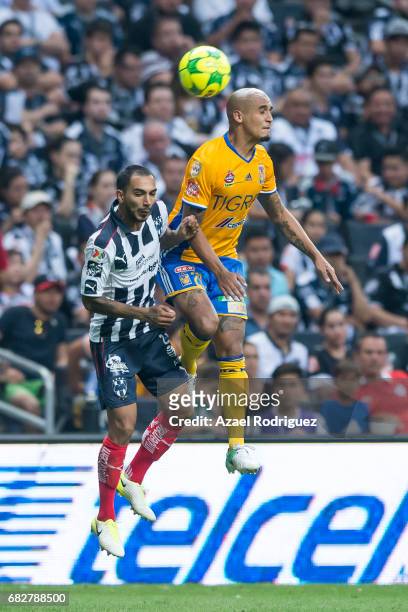 Luis Rodriguez of Tigres fights for the ball with Edgar Castillo of Monterrey during the quarter finals second leg match between Monterrey and Tigres...