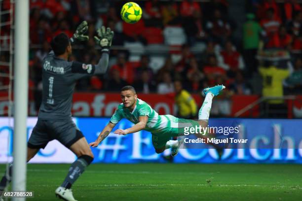 Jonathan Rodriguez of Santos tries to score against Alfredo Talavera of Toluca during the quarter finals second leg match between Toluca and Santos...