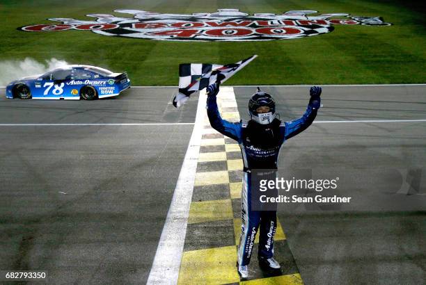 Martin Truex Jr., driver of the Auto-Owners Insurance Toyota, celebrates after a burnout after winning the Monster Energy NASCAR Cup Series Go...