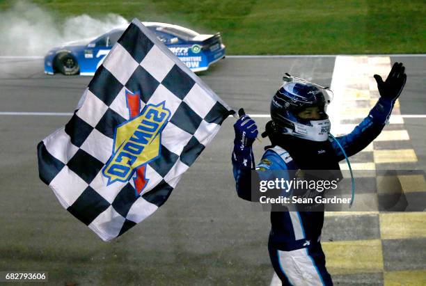 Martin Truex Jr., driver of the Auto-Owners Insurance Toyota, celebrates after a burnout after winning the Monster Energy NASCAR Cup Series Go...