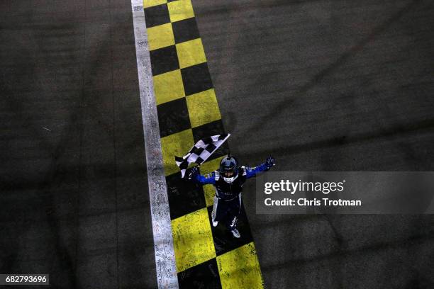 Martin Truex Jr., driver of the Auto-Owners Insurance Toyota, celebrates after a burnout after winning the Monster Energy NASCAR Cup Series Go...