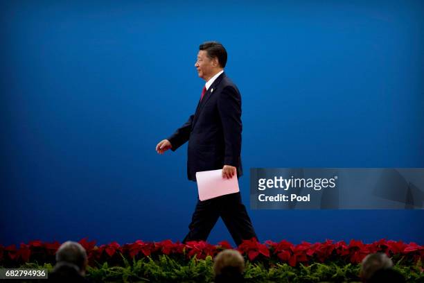 Chinese President Xi Jinping leaves the stage after speaking during the opening ceremony of the Belt and Road Forum at the China National Convention...