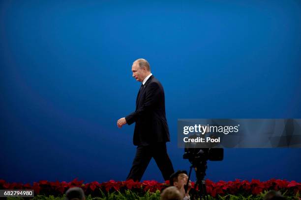 Russian President Vladimir Putin leaves the stage after speaking during the opening ceremony of the Belt and Road Forum at the China National...
