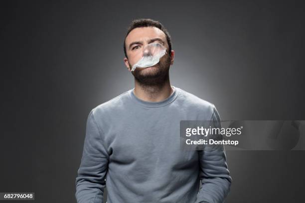 young man inflating the bubble - bubble gum bubble stock pictures, royalty-free photos & images