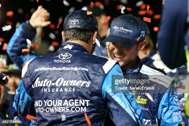 Martin Truex Jr., driver of the Auto-Owners Insurance Toyota, celebrates with his crew in Victory Lane after winning the Monster Energy NASCAR Cup...