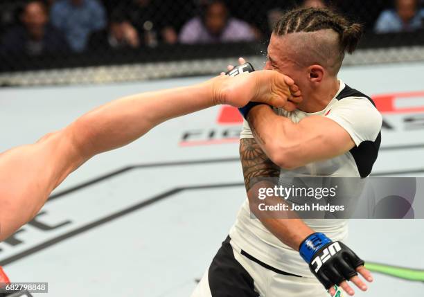 Joanna Jedrzejczyk kicks Jessica Andrade in their UFC women's strawweight championship fight during the UFC 211 event at the American Airlines Center...