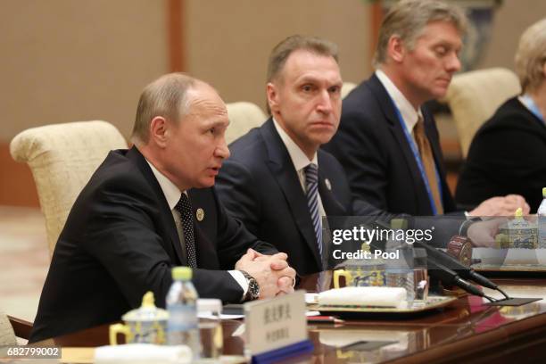 Russian President Vladimir Putin speaks with Chinese President Xi Jinping during a bilateral meeting at Diaoyutai State Guesthouse in Beijing, China,...