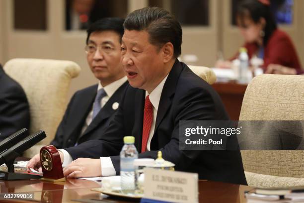 Chinese President Xi Jinping speaks with Russian President Vladimir Putin during a bilateral meeting at Diaoyutai State Guesthouse in Beijing, China,...