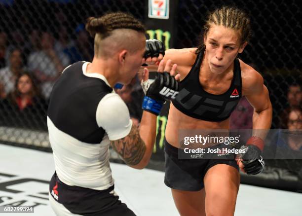 Joanna Jedrzejczyk punches Jessica Andrade in their UFC women's strawweight championship fight during the UFC 211 event at the American Airlines...