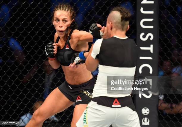 Joanna Jedrzejczyk punches Jessica Andrade in their UFC women's strawweight championship fight during the UFC 211 event at the American Airlines...