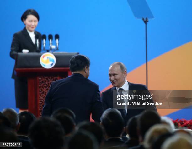 Russian President Vladimir Putin greets Chinese President Xi Jinping during the Belt and Road Forum for International Cooperation on May 14, 2017 in...
