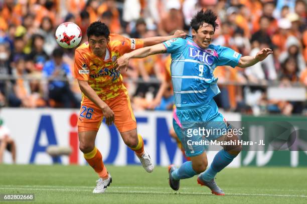 Hiroshi Futami of Shimizu S-Pulse and Cho Dong Geon of Sagan Tosu compete for the ball during the J.League J1 match between Shimizu S-Pulse and Sagan...