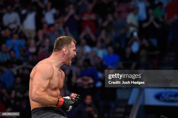 Stipe Miocic celebrates his TKO victory over Junior Dos Santos in their UFC heavyweight championship fight during the UFC 211 event at the American...