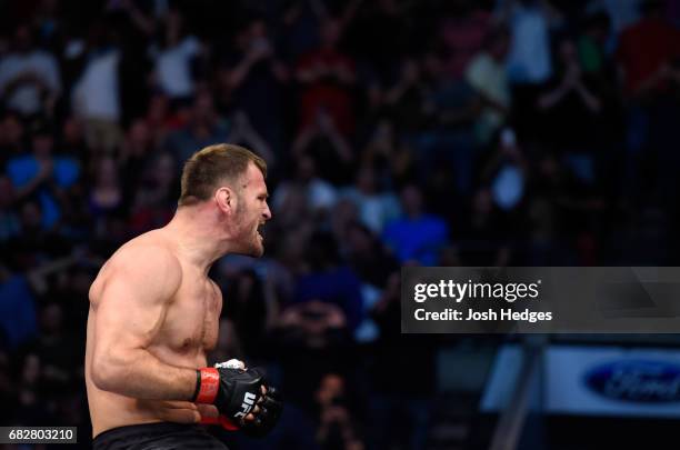 Stipe Miocic celebrates his TKO victory over Junior Dos Santos in their UFC heavyweight championship fight during the UFC 211 event at the American...