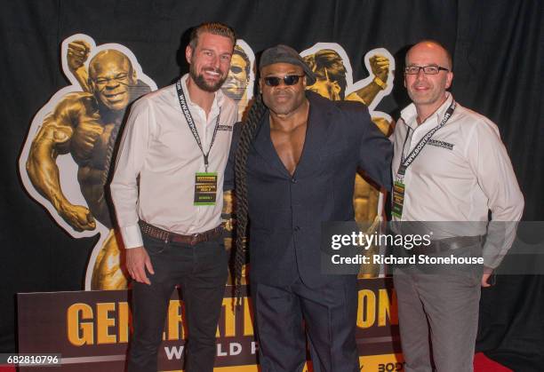 Professional bodybuilder Kai Greene poses with Executive Producers Ollie Upton and Nick Orton as he arrives to attend the premiere of 'Generation...