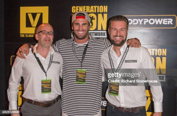 Professional bodybuilder Calum Von Moger poses with Executive Producers Nick Orton and Ollie Upton as he arrives to attend the premiere of...