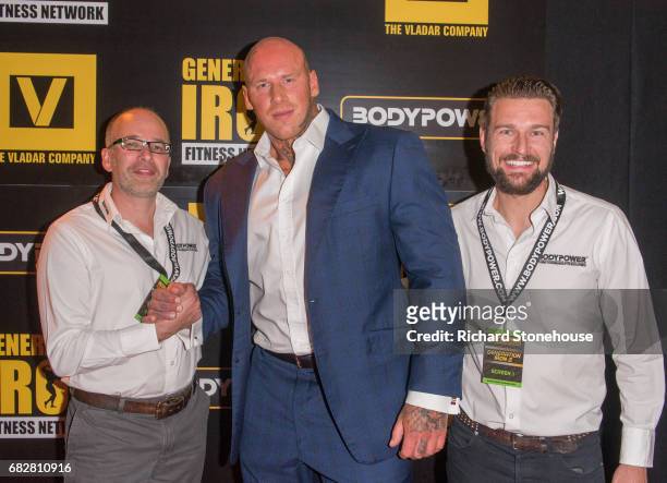 Professional bodybuilder Martyn Ford poses with Executive Producers Nick Orton and Ollie Upton as he arrives to attend the premiere of 'Generation...