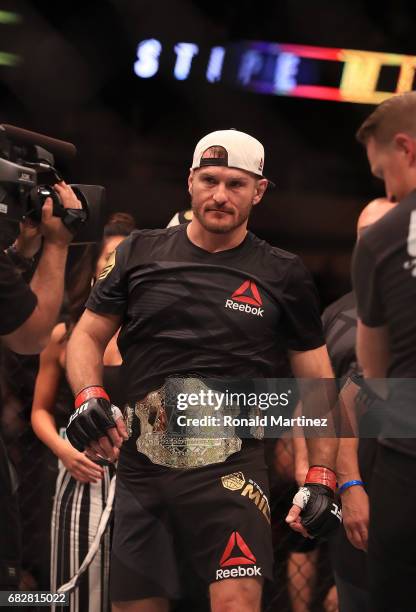 Stipe Miocic celebrates his knockout win against Junior Dos Santos in their Heavyweight Title bout during UFC 211 at American Airlines Center on May...