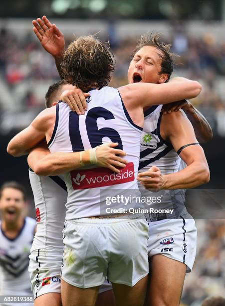 David Mundy of the Dockers is congratulated by team mates after kicking the winning goal during the round eight AFL match between the Richmond Tigers...