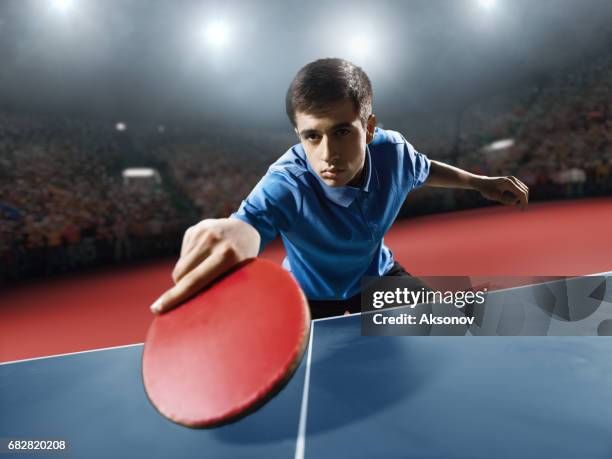 young ping pong player playing table tennis game - table tennis world championships stock pictures, royalty-free photos & images