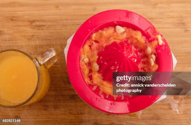 fruit juice and lemon squeezer. - zitronenpresse stock-fotos und bilder