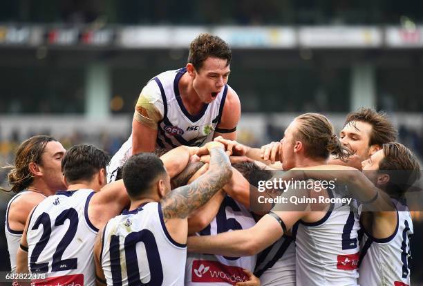 David Mundy of the Dockers is congratulated by team mates after kicking the winning goal during the round eight AFL match between the Richmond Tigers...