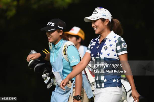 Asako Fujimoto of Japan smiles as she walks the 1st fairway during the final round of the Hoken-no-Madoguchi Ladies at the Fukuoka Country Club...