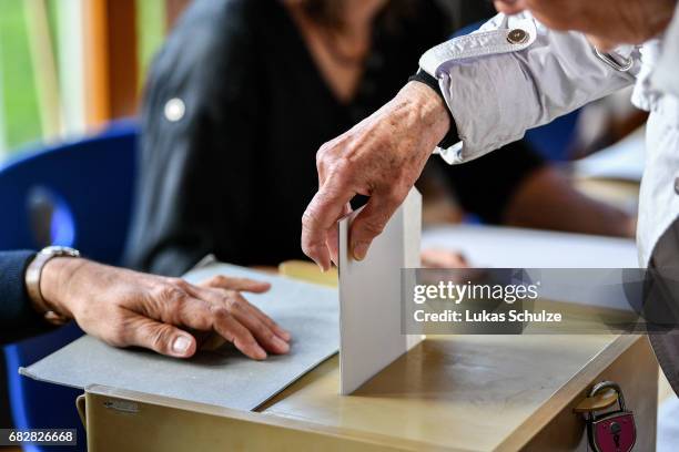 Voter casts her ballot in state elections in North Rhine-Westphalia on May 14, 2017 in Aachen, Germany. The election today, the third German state...