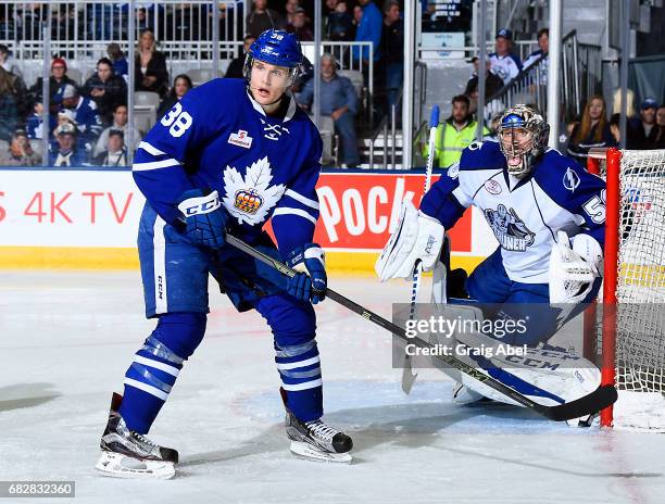 Colin Greening of the Toronto Marlies puts a screen on goalie Mike McKenna of the Syracuse Crunch during game 4 action in the Division Final of the...