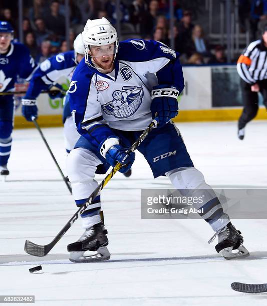 Erik Condra of the Syracuse Crunch controls the puck against the Toronto Marlies during game 4 action in the Division Final of the Calder Cup...