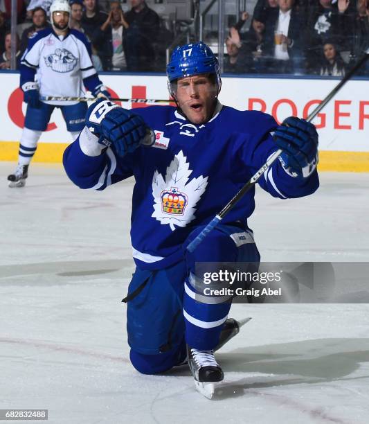 Rich Clune of the Toronto Marlies celebrates his goal against the Syracuse Crunch during game 4 action in the Division Final of the Calder Cup...