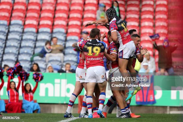 Joe Wardle of the Knights celebrates his try during the round 10 NRL match between the Newcastle Knights and the Canberra Raiders at McDonald Jones...