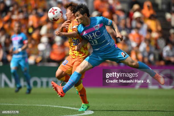 Yuzo Kobayashi of Sagan Tosu and Shota Kaneko of Shimizu S-Pulse compete for the ball during the J.League J1 match between Shimizu S-Pulse and Sagan...