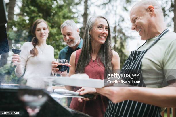 adult friends wine and bbq - couple grilling stock pictures, royalty-free photos & images